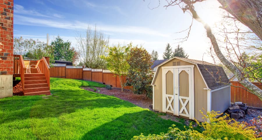 Fenced backyard with storage shed in Sioux City